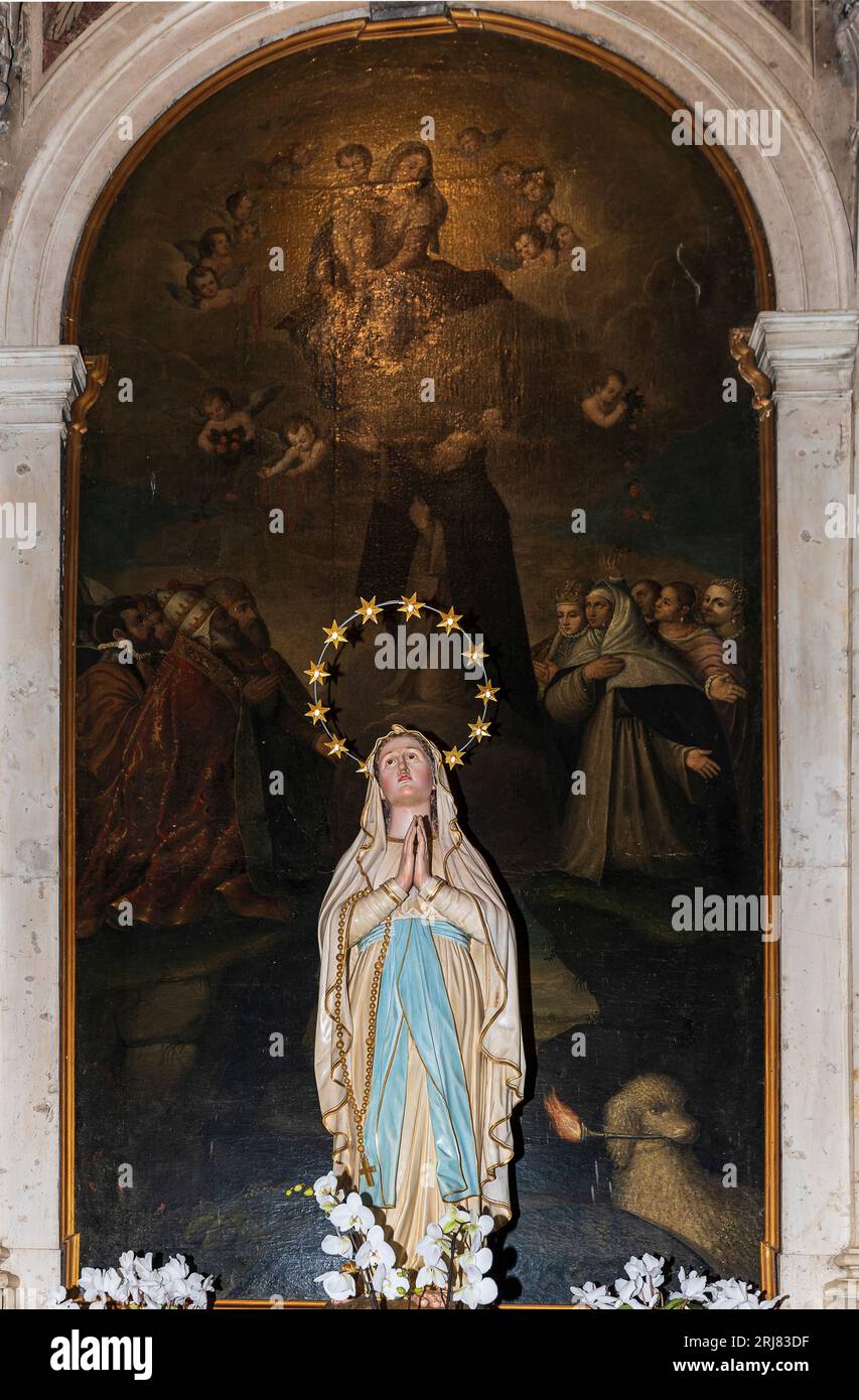 Italy Veneto  Mel - Church of Santa Maria Annunziata (18th century) - Fabrizio Vecellio - Madonna del Rosario con San Domenico e altri santi Stock Photo