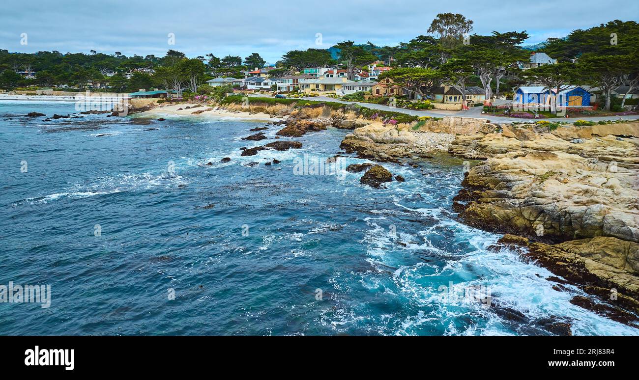 Wide aerial view of Carmel Beach with distant Clinton Walker House by