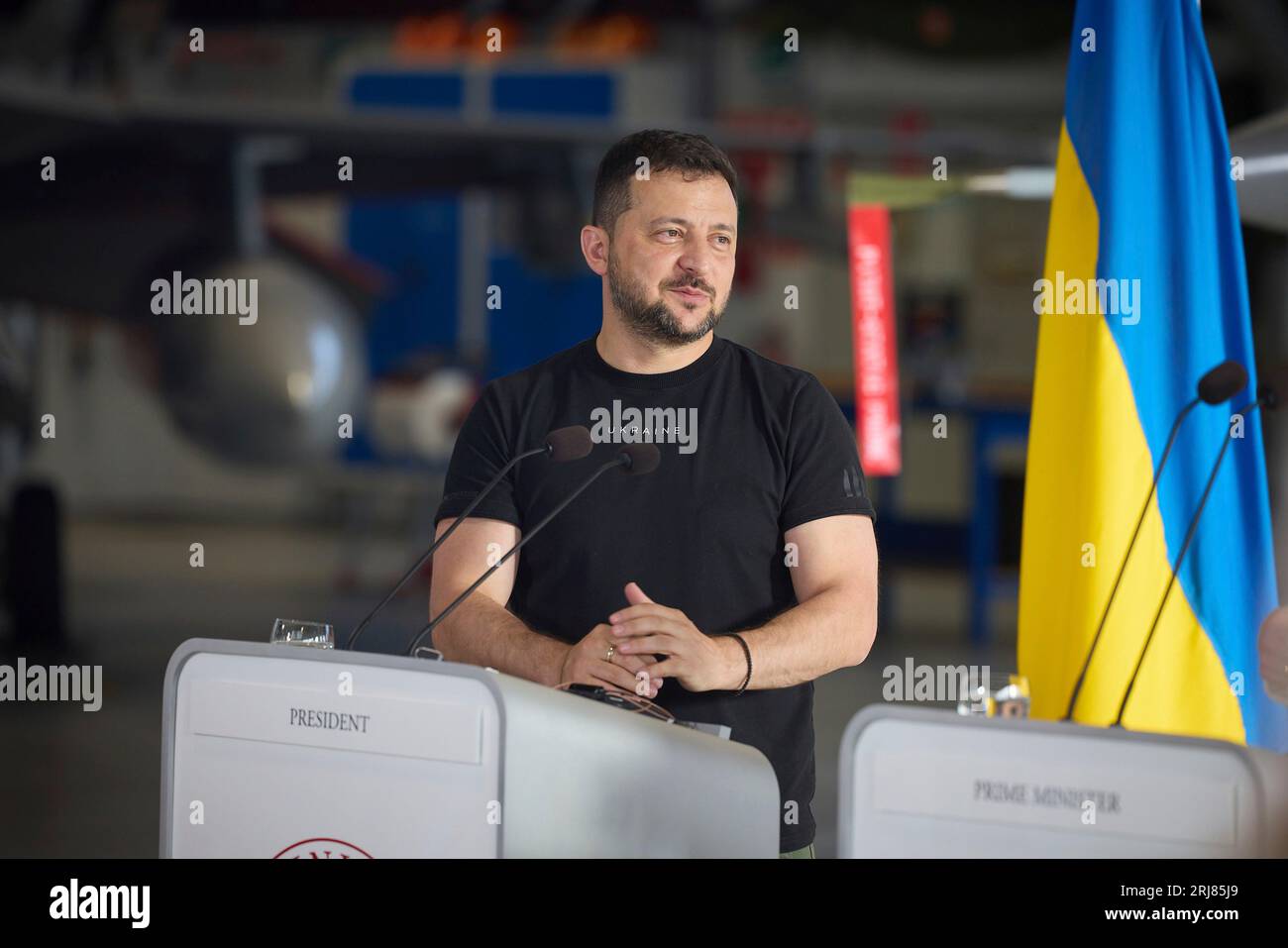 Vojens, Denmark. 20th Aug, 2023. Danish Prime Minister Mette Frederiksen, right, and Ukrainian President Volodymyr Zelenskyy, left, hold a joint press conference at Skrydstrup Airbase, August 20, 2023 in Vojens, Denmark. Denmark pledged 19 F-16 fighters to Ukraine, which could be delivered around the end of the year. Credit: Pool Photo/Ukrainian Presidential Press Office/Alamy Live News Stock Photo