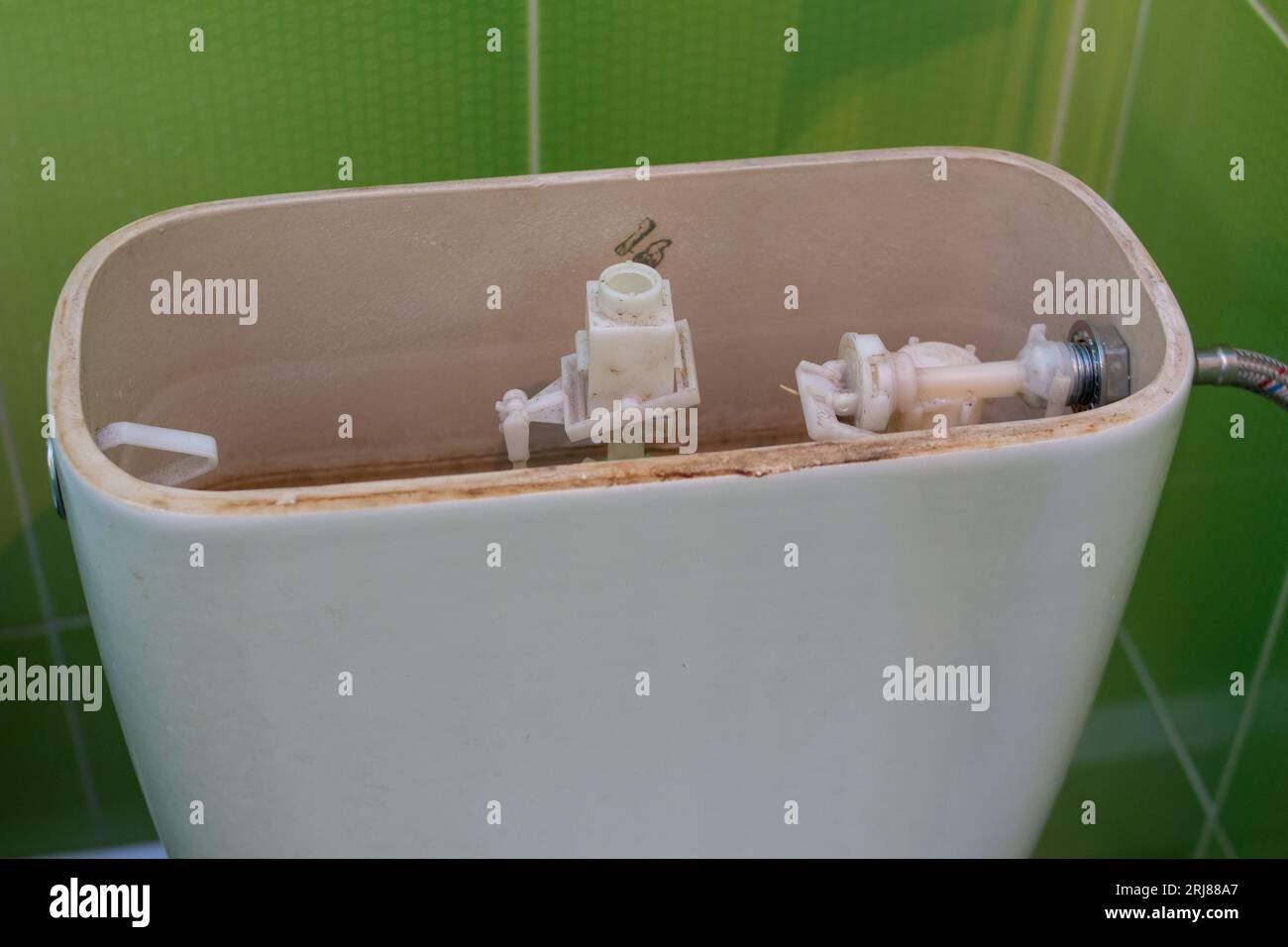 repair toilet toilet tank that drains water, old toilet toilet repair Stock Photo