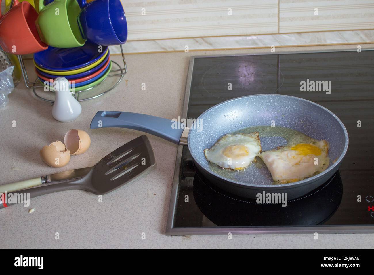 On the electric cooker cooked eggs for breakfast Stock Photo