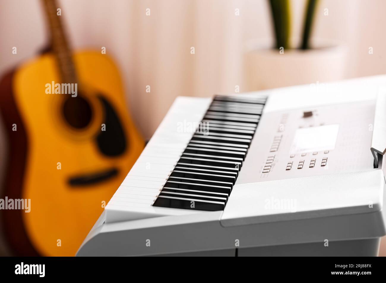 Modern synthesizer in room, closeup Stock Photo