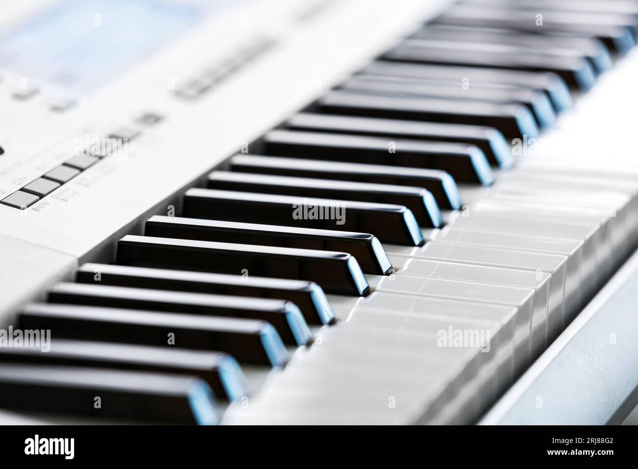 Modern synthesizer in room, closeup Stock Photo