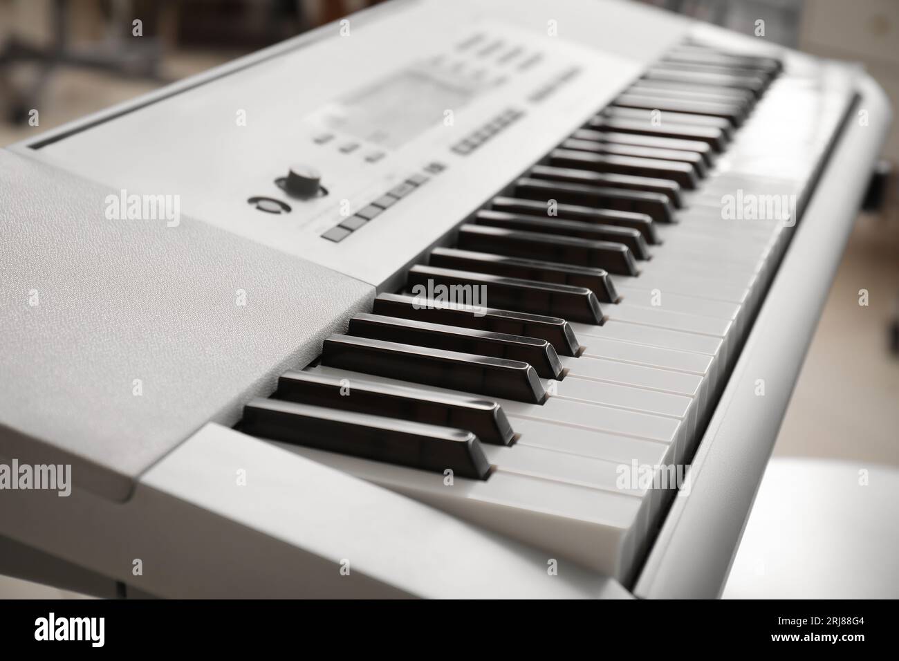 Modern synthesizer in room, closeup Stock Photo