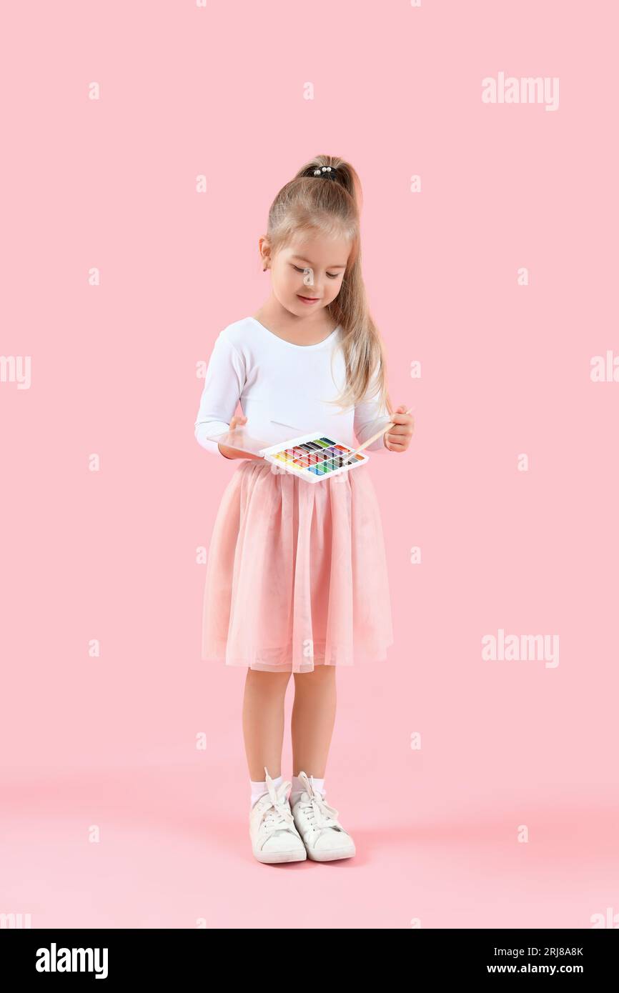 Cute little girl with paints and brush on pink background Stock Photo ...