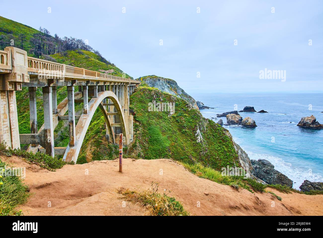 Rocky Creek Bridge with green hillside background and gorgeous Pacific ...