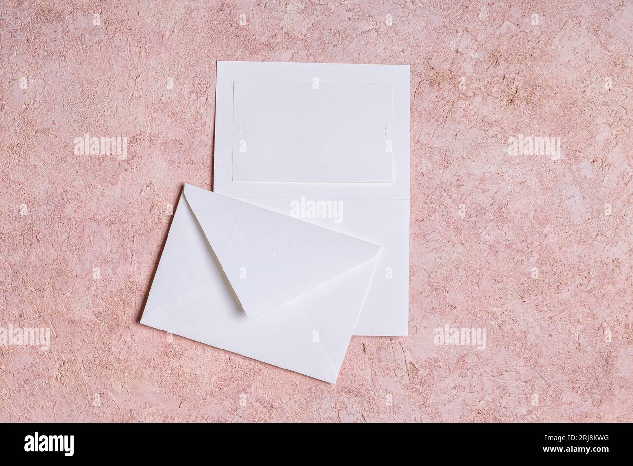 Paper envelope, wedding invitation with copy space for text on a pink