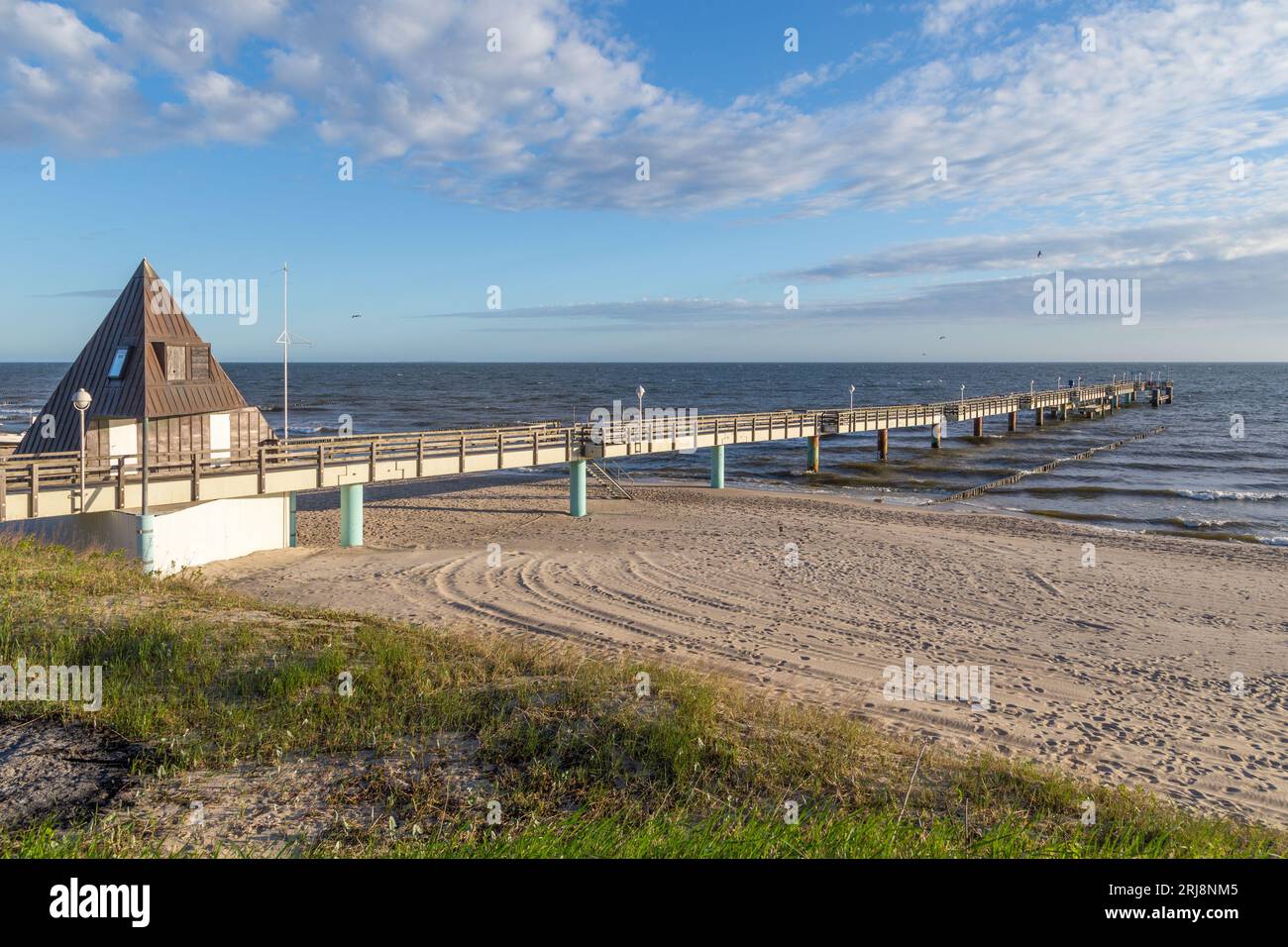 historic beautiful pier at the baltic sea in Ahlbeck Heringsdorf with empty beach in Usedom Stock Photo