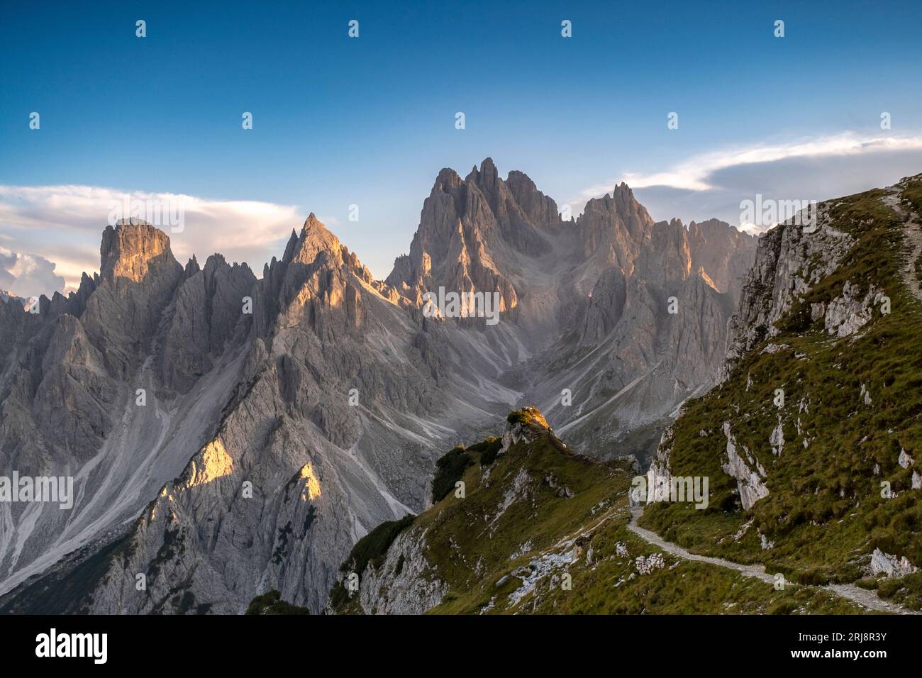 Mountain Peaks of Tre Cime under the blue sky Stock Photo