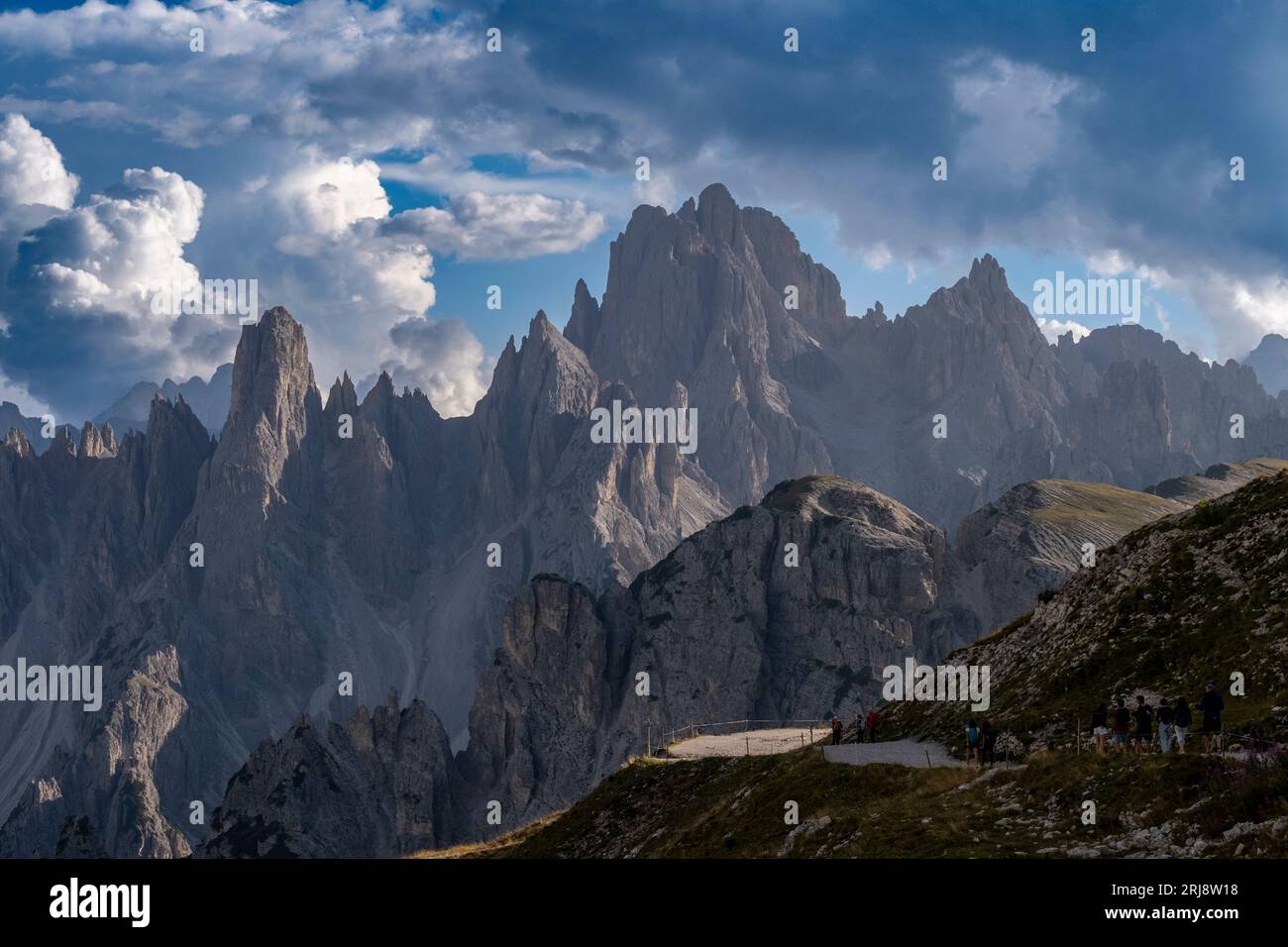 Mountain Peaks of Tre Cime under the blue sky Stock Photo