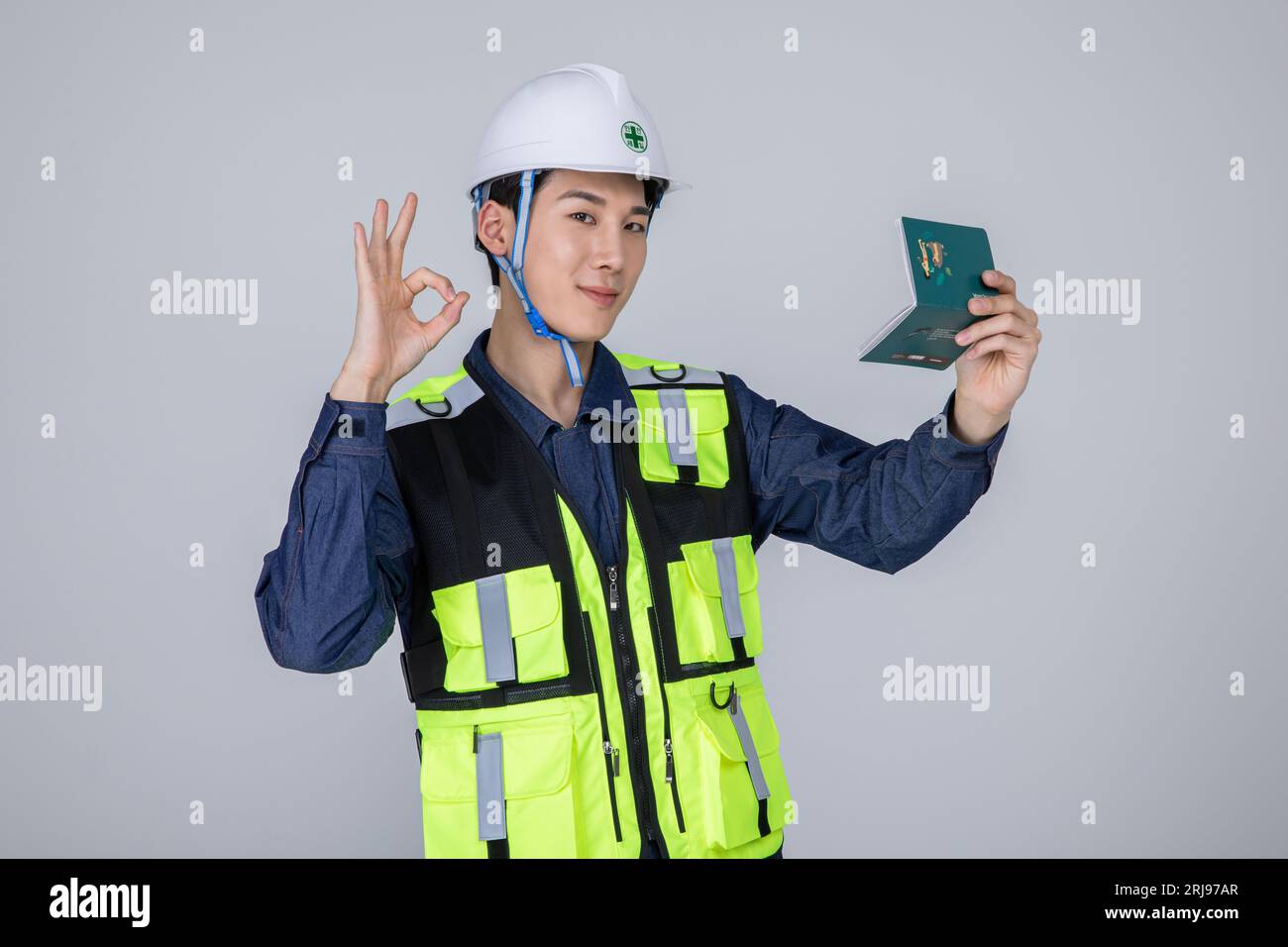 millennials and gen z, korean asian young man, site staff holding a bankbook Stock Photo