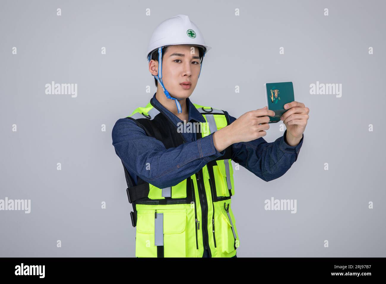 millennials and gen z, korean asian young man, site staff pointing a bankbook Stock Photo