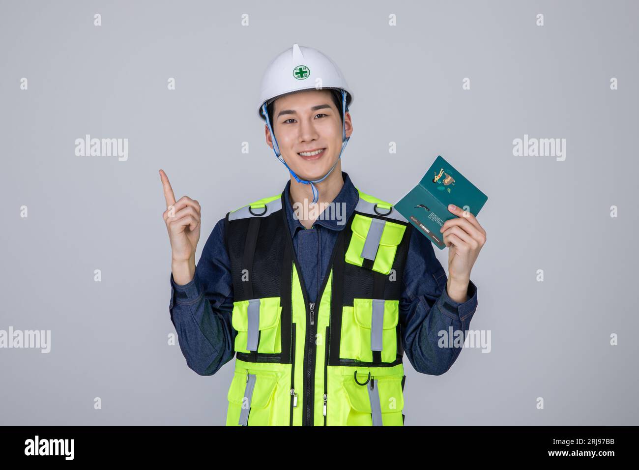millennials and gen z, korean asian young man, site staff checking a bankbook Stock Photo