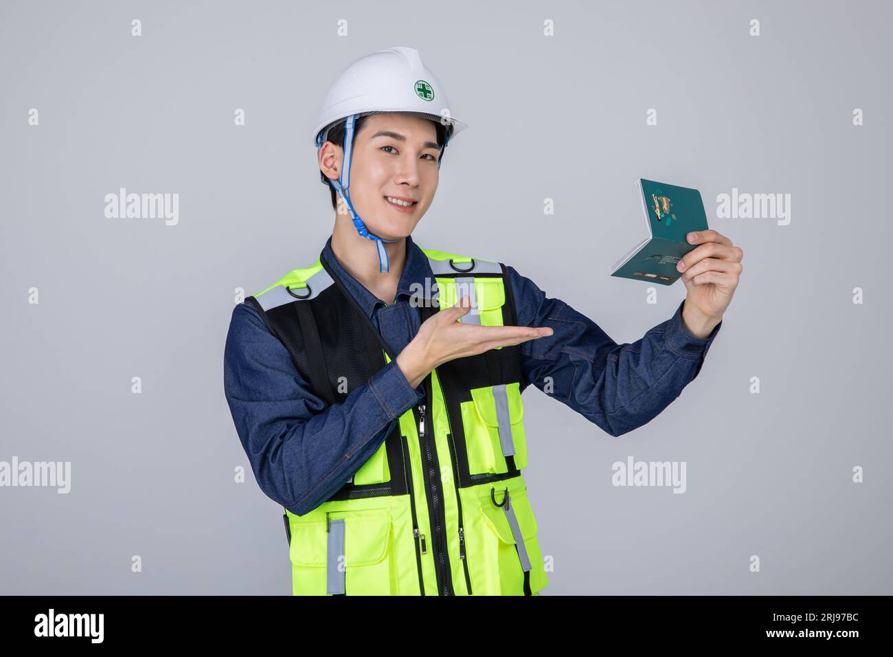 millennials and gen z, korean asian young man, site staff holding a bankbook Stock Photo