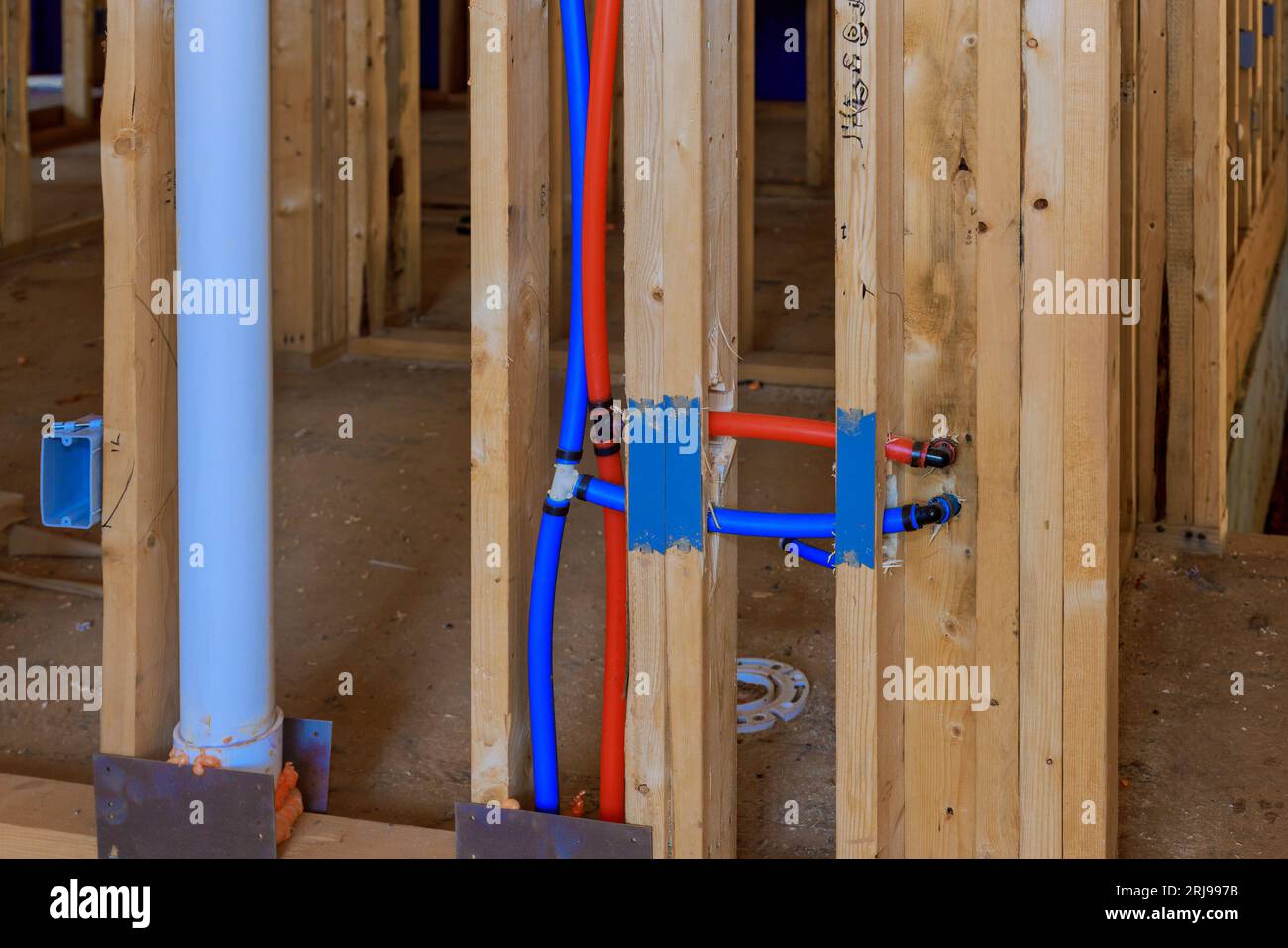 New home a construction integrating water systems with red and blue pvc