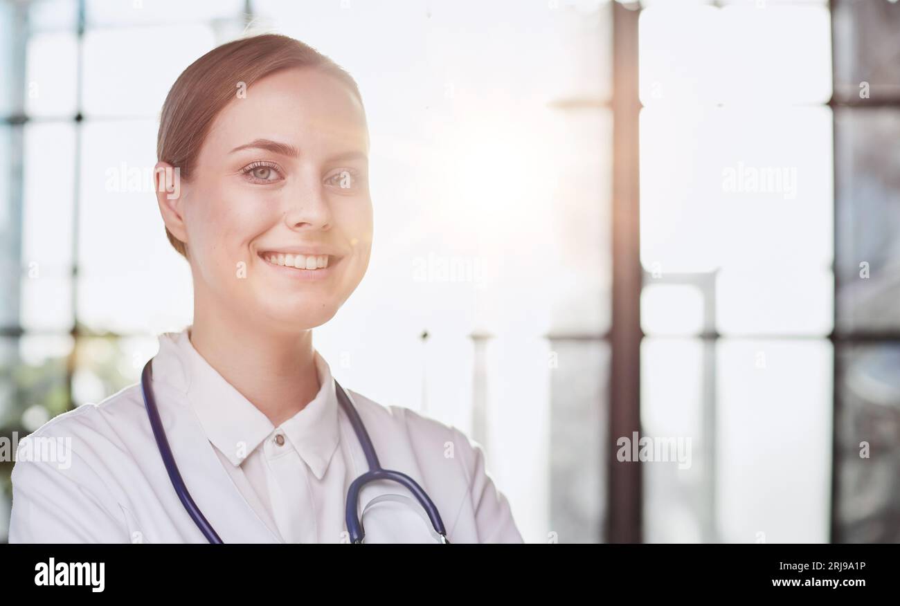 Confident female doctor posing in her office Stock Photo