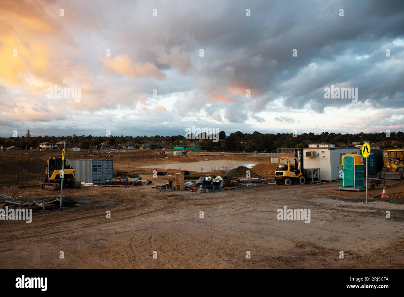 During non-working hours, a construction site stands empty, waiting for the work to resume. Stock Photo