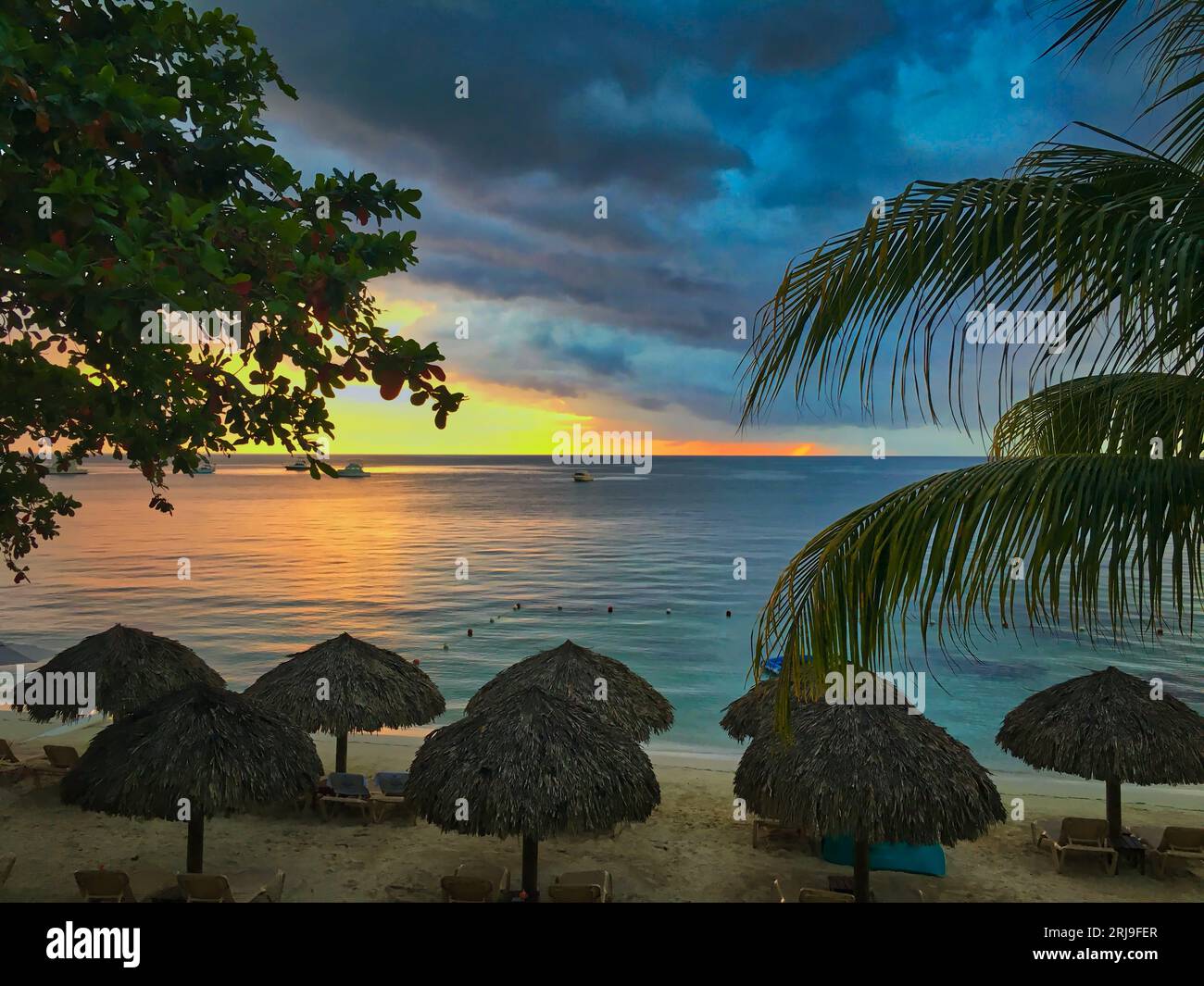 Beautiful Sunset from a Tropical Beach Overlooking the Ocean in Jamaica  Stock Photo - Alamy, image size:1300x1065