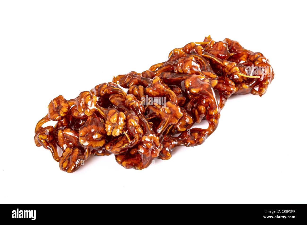 Sausage made from grape juice and walnuts. Traditional Turkish dessert. Walnut sausage on white