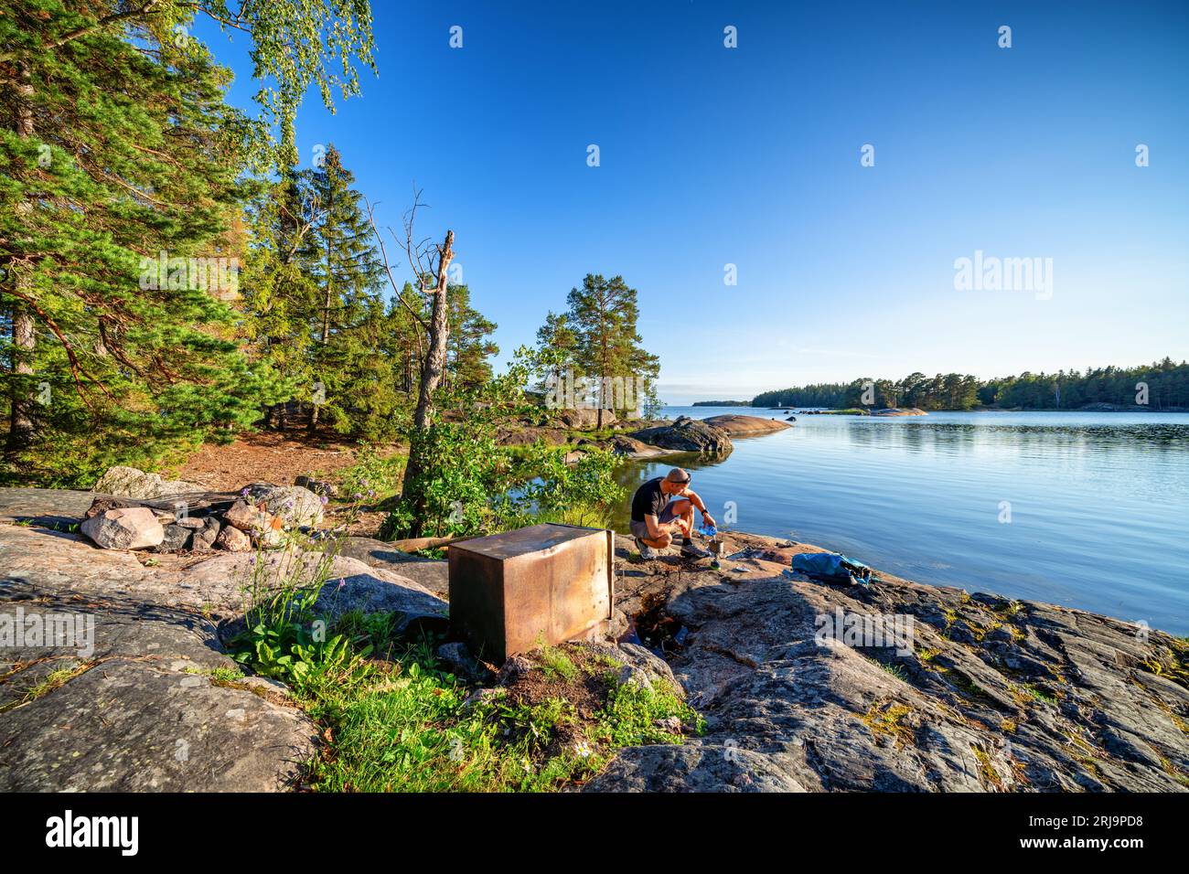 Starting a gas cooker at Linlo island, Kirkkonummi, Finland Stock Photo