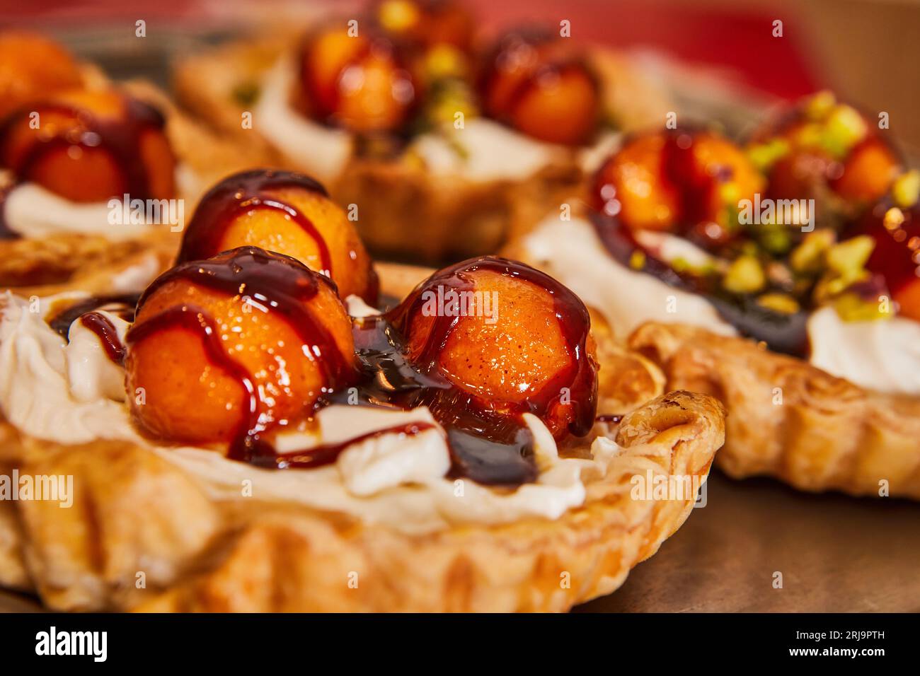 Summer sweetness, melon and caramel dessert baskets with cream. Melon