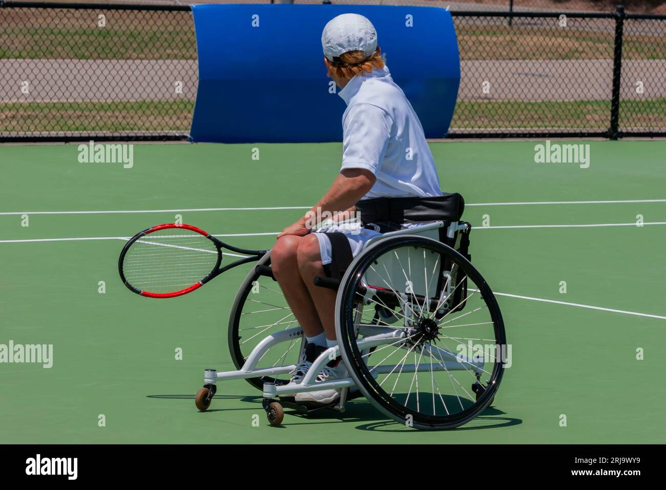 A wheelchair bound athlete on the tennis court Stock Photo Alamy