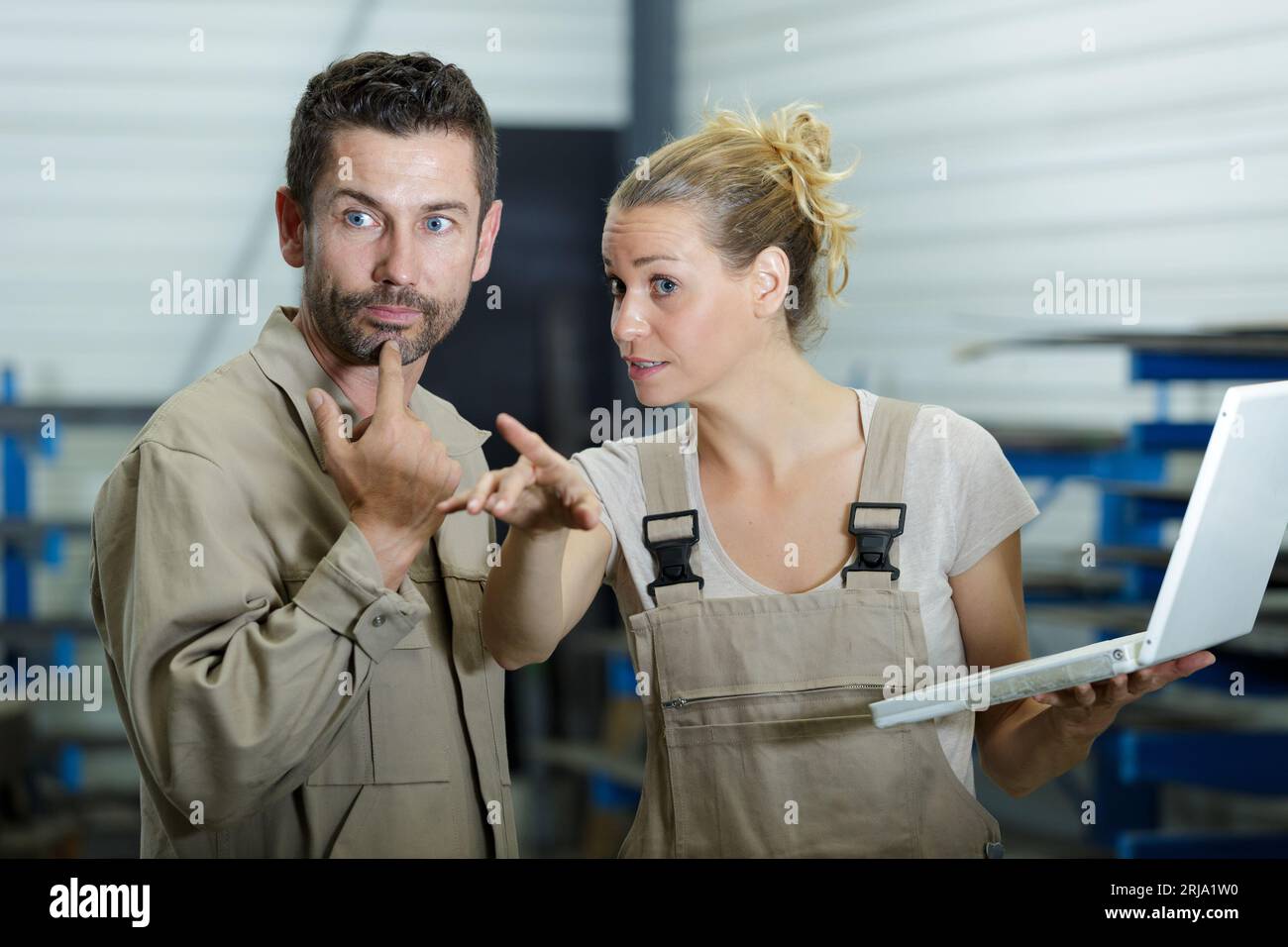 engineers in mechanical factory checking instructions Stock Photo - Alamy