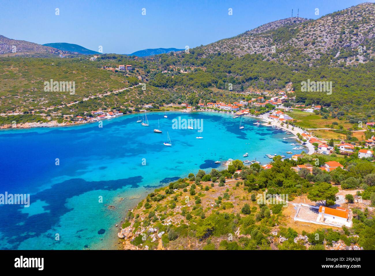 Small fishing village of Posidonio with turquoise blue Aegean sea on Samos island, Greece Stock Photo
