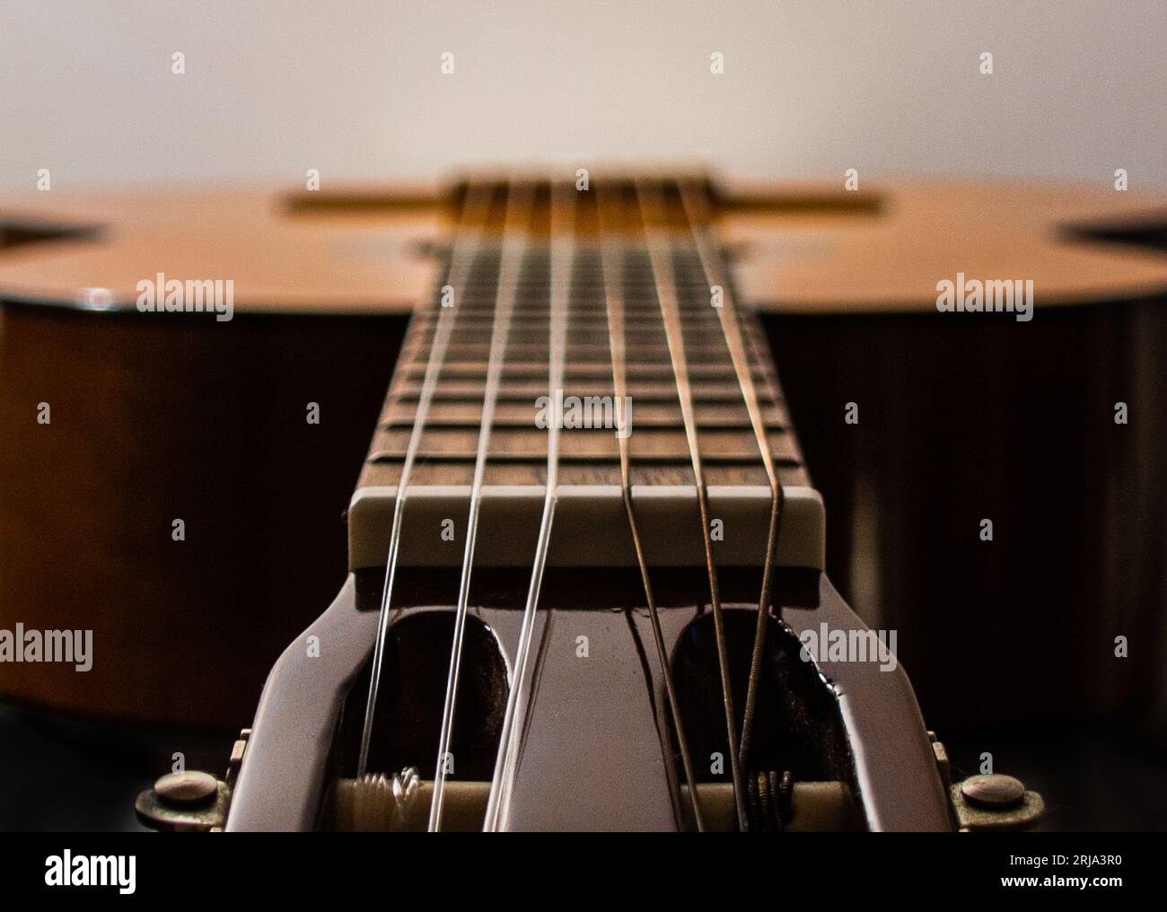 A closeup shot of an acoustic guitar. Stock Photo