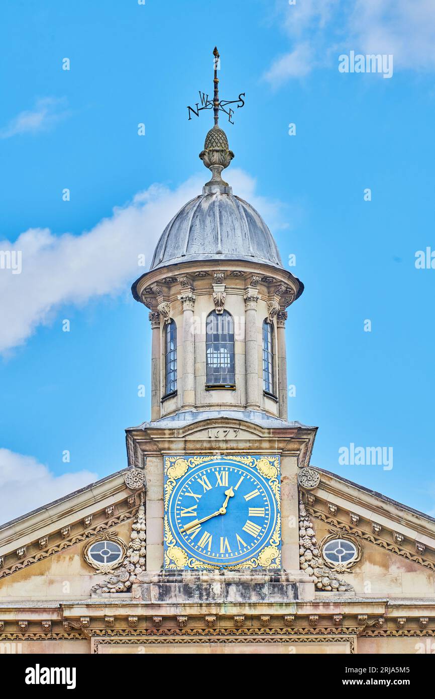 Dome and clock above the entrance to the chapel at Emmanuel College, University of Cambridge, England. Stock Photo