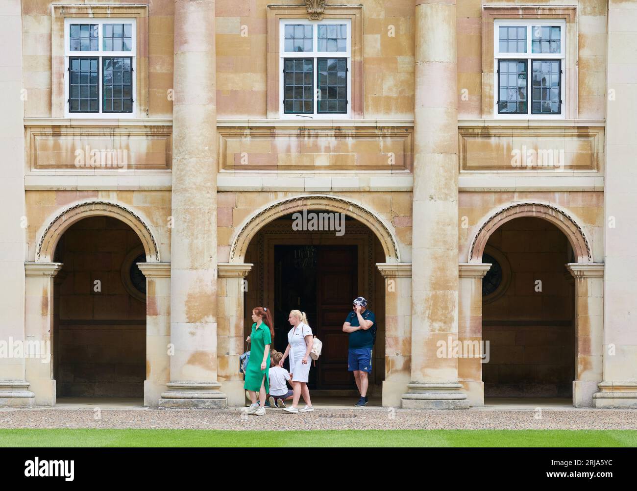 Visitors leave the chapel at Emmanuel College, University of Cambridge, England. Stock Photo