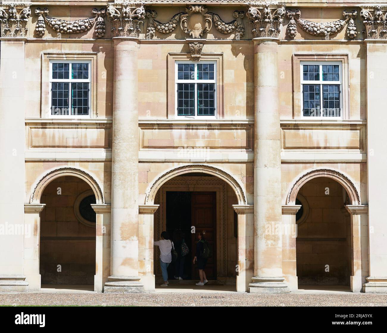 Trio of arches and windows at the entrance to the chapel of Emmanuel College, University of Cambridge, England. Stock Photo