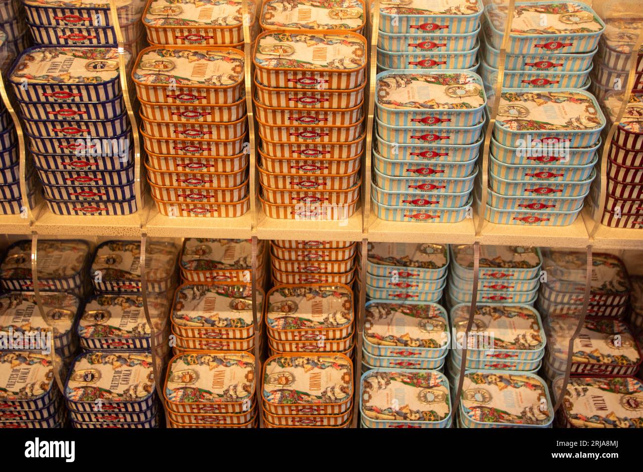At Braga, Portugal, On 07,17,2023, wall of colored tin cans with variety of seafood Stock Photo