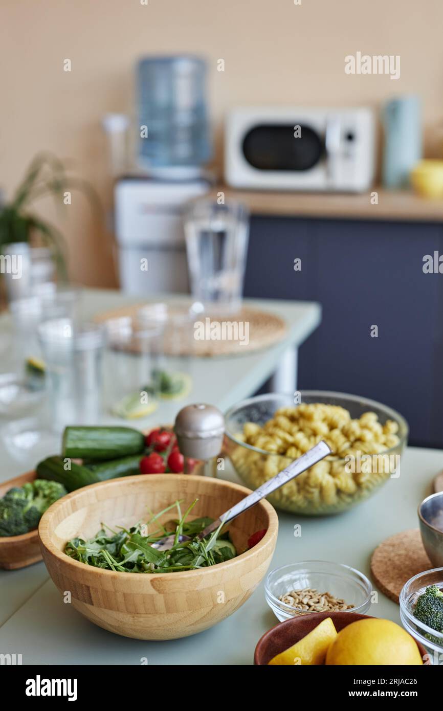Vertical background image of kitchen setting with healthy food and ...