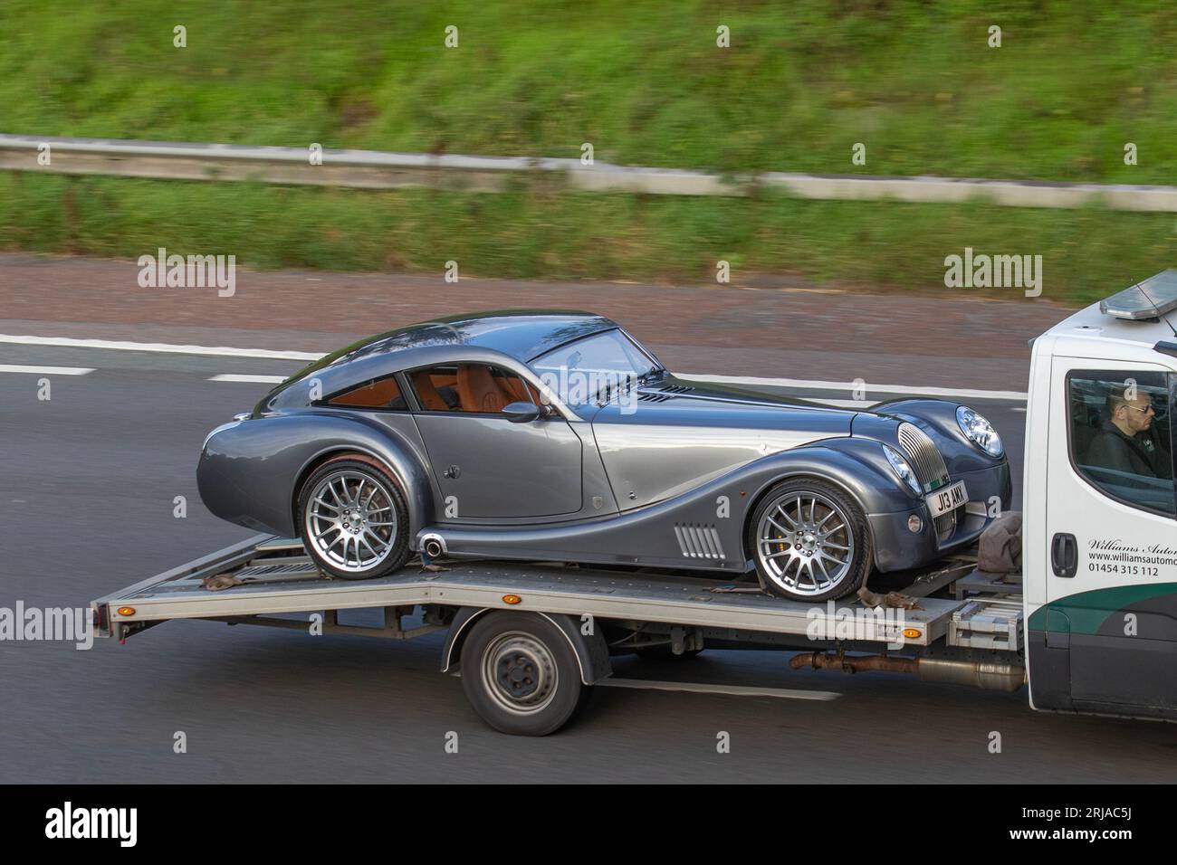 Williams Automobiles Ltd. 2009 Morgan Aeromax Coupe V8 Grey Car Coupe Petrol 4799 cc, 367Bhp 4.8 litre BMW V8 engine; British performance cars travelling on the M6 motorway in Greater Manchester, UK Stock Photo