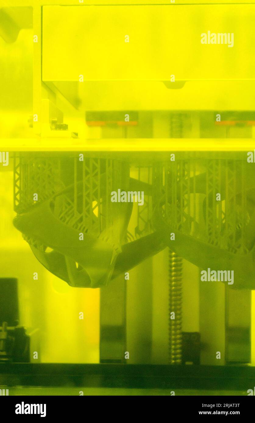 Printed models on 3D printer closeup. Objects printed on photopolymer