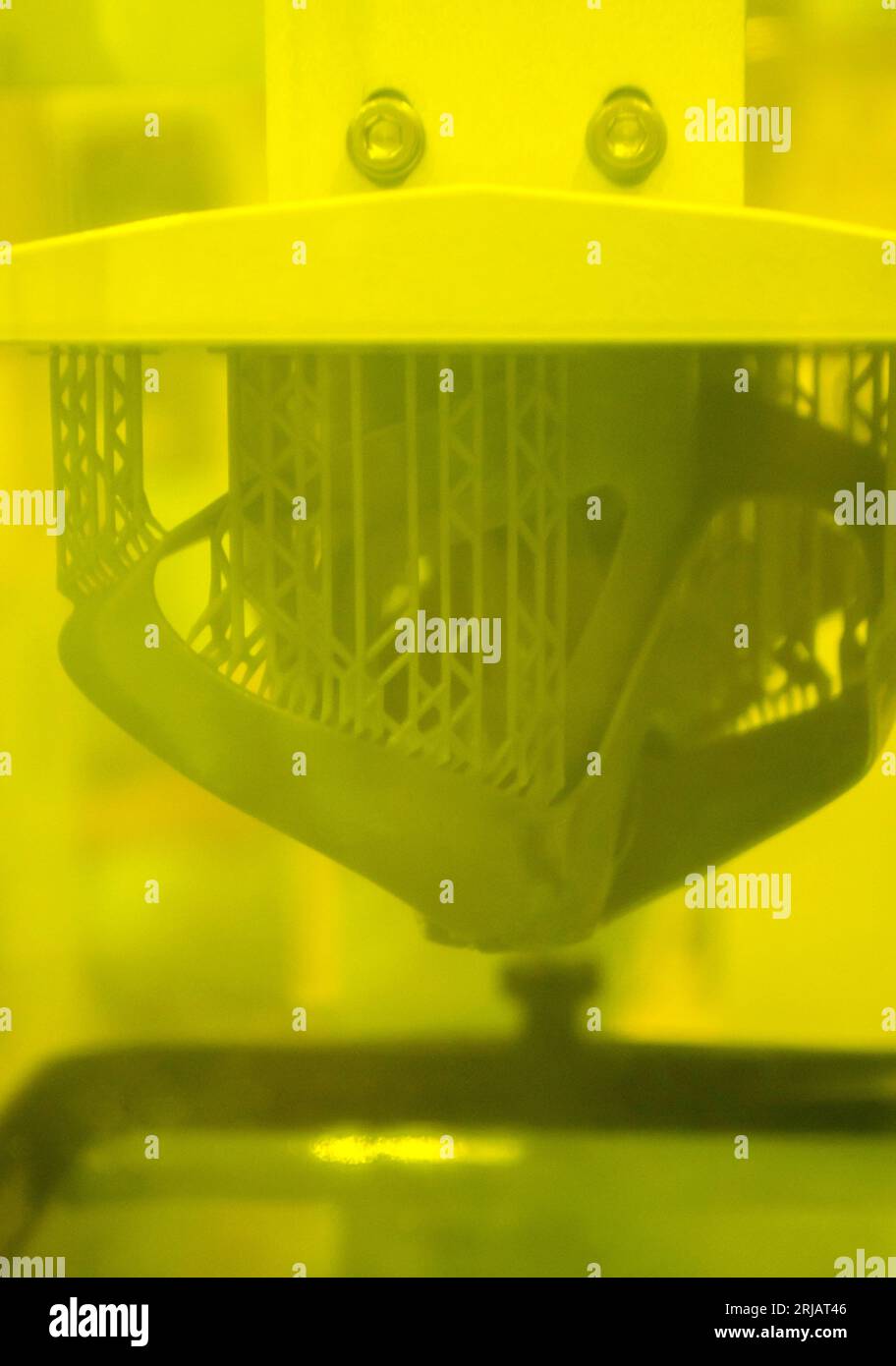 Printed models on 3D printer closeup. Objects printed on photopolymer