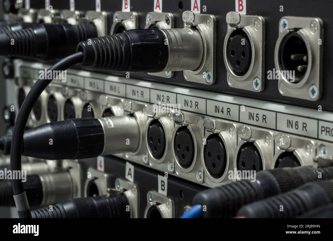 XLR jack cable connected at rear end of equipment Stock Photo Alamy