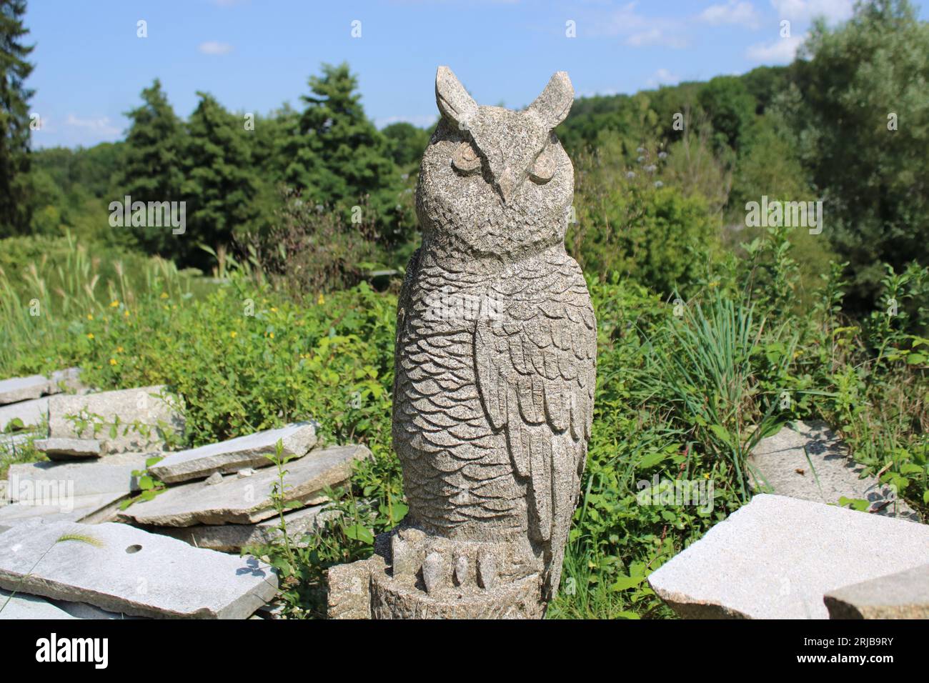 A statue of an owl carved in granite by the famous 19th century artist François Michaud located in the village of Masgot in Creuse region of France. Stock Photo