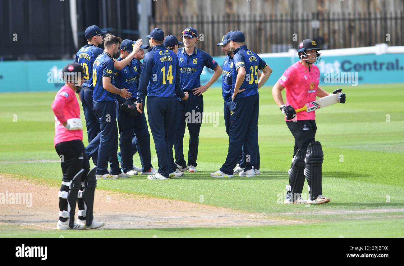 Hove UK 22nd August 2023 - Warwickshire players congratulate Ed Barnard  after he had taken the wicket of Sussex Sharks opener Harrison Ward (right) during their One Day Cup cricket match at the 1st Central County Ground in Hove : Credit Simon Dack /TPI/ Alamy Live News Stock Photo