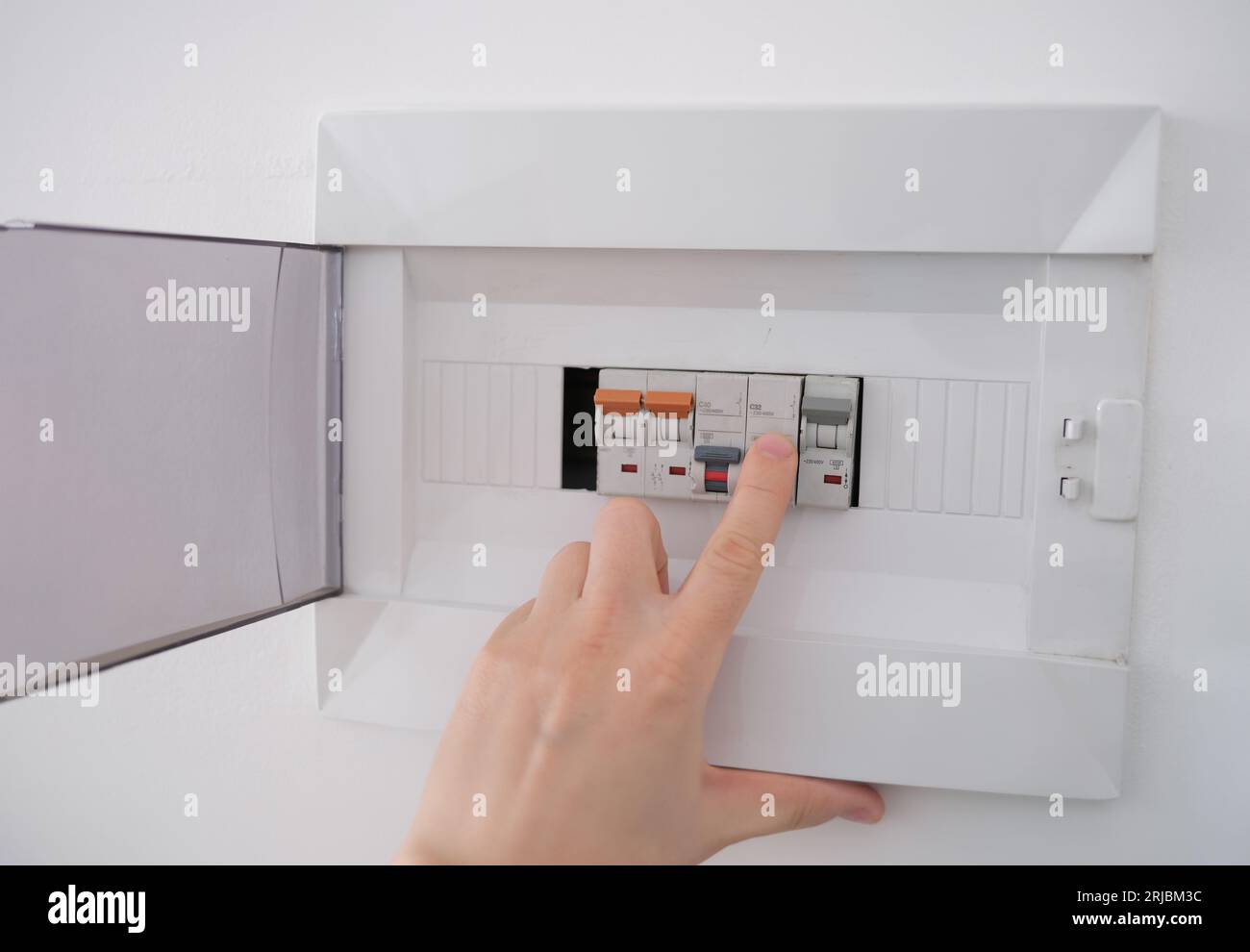 Turning on circuit breaker on control panel after it tripped due to