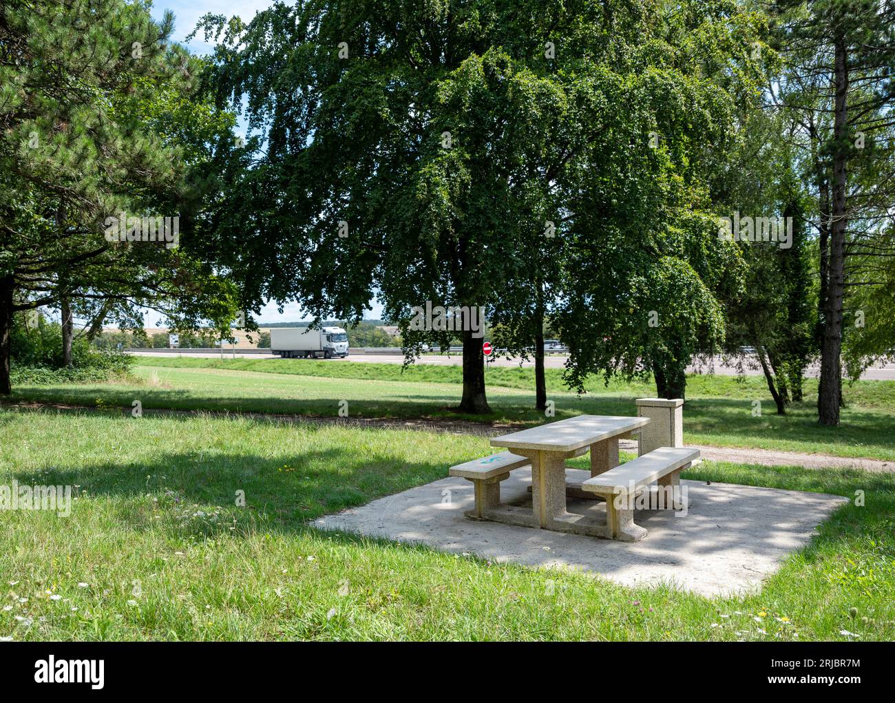 picnic table and benches on resting area of french motorway Stock Photo