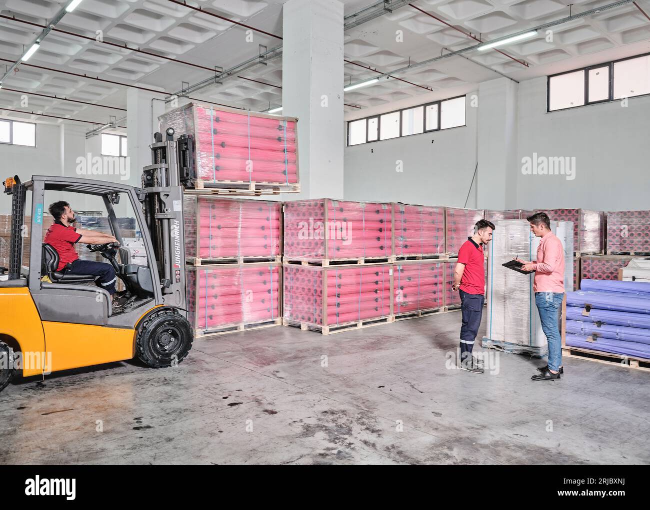 big paper rolls in a factory. Brown paper rolls used for packaging in