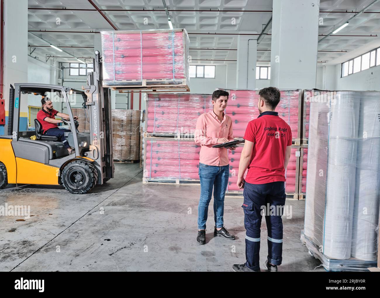 big paper rolls in a factory. Brown paper rolls used for packaging in