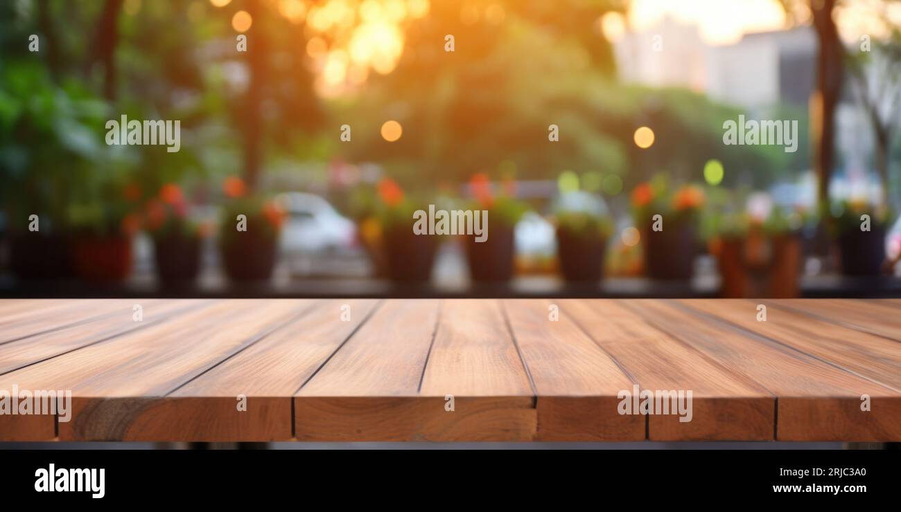 The empty wooden table top with blur background of outdoor cafe in the ...