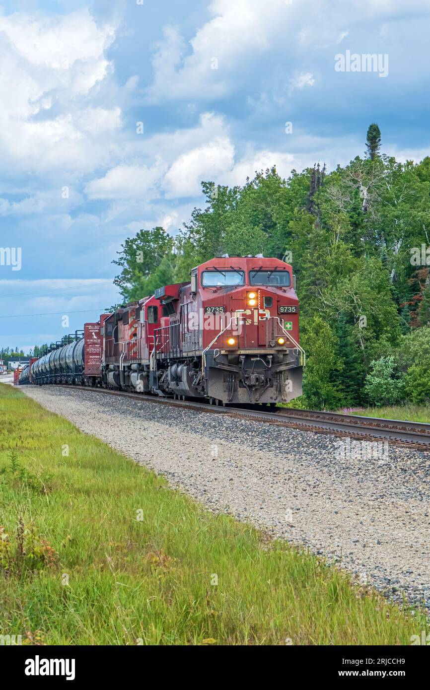 Canadian Pacific Freight Train rolls through the small village of