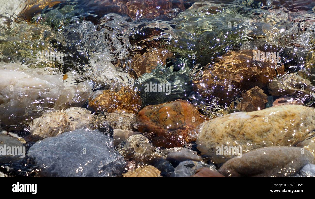 colourful pebbles on sea side Stock Photo