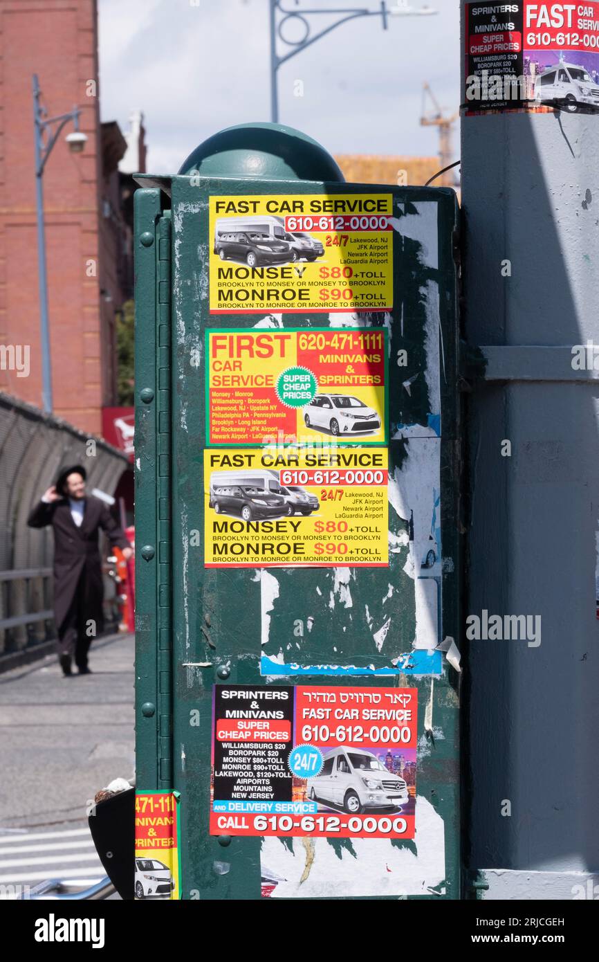 Advertisements for car services in Williamsburg, Brooklyn, some to another Hasidic community, Monsey, New York. Stock Photo