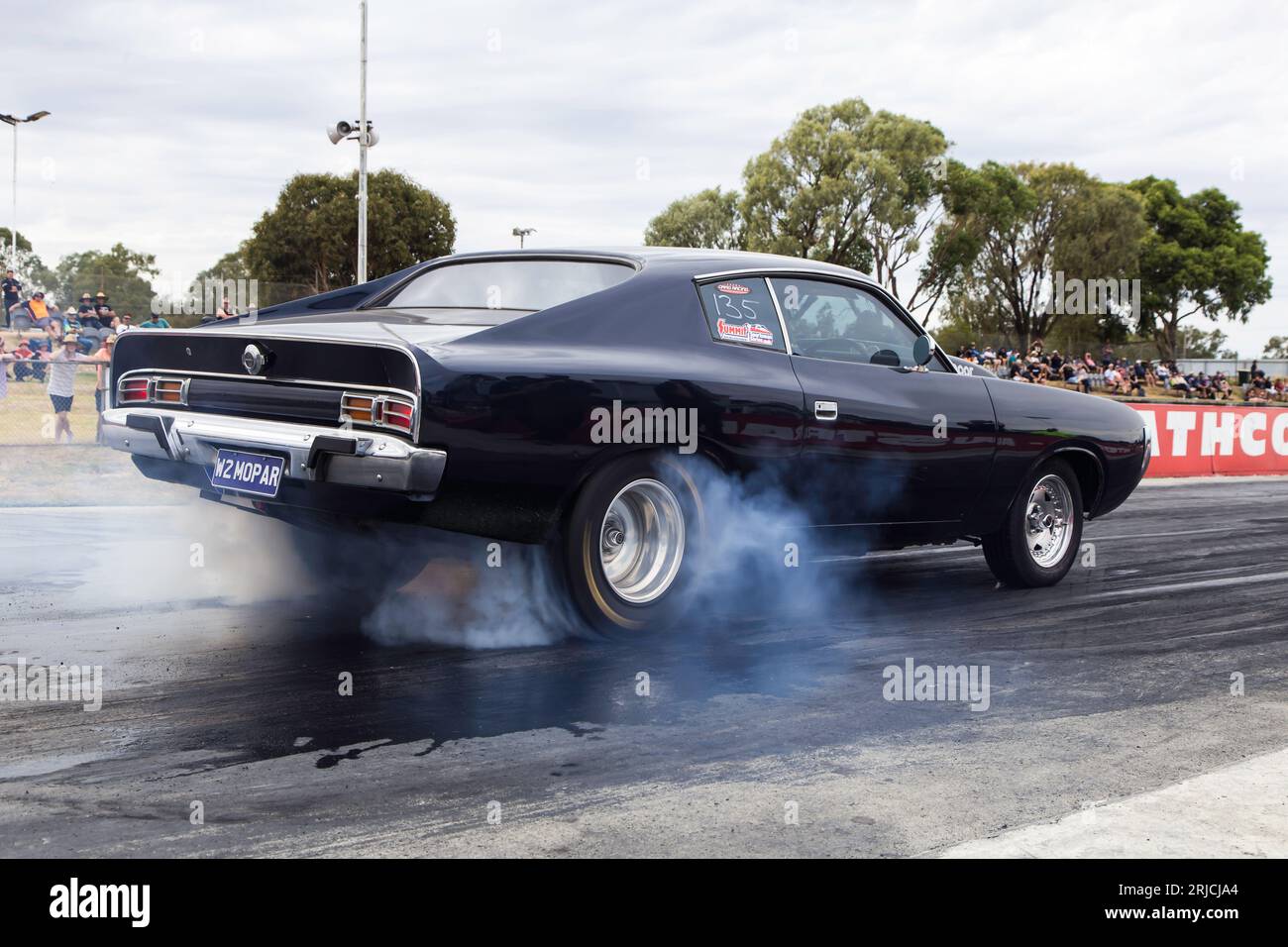 Dragway racing with heaps of smoke as cars rip down the track Stock ...