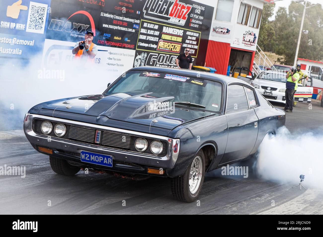 Dragway racing with heaps of smoke as cars rip down the track Stock ...